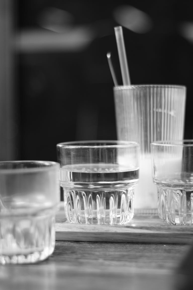 Artistic black and white photo of glassware, highlighting simplicity and elegance.