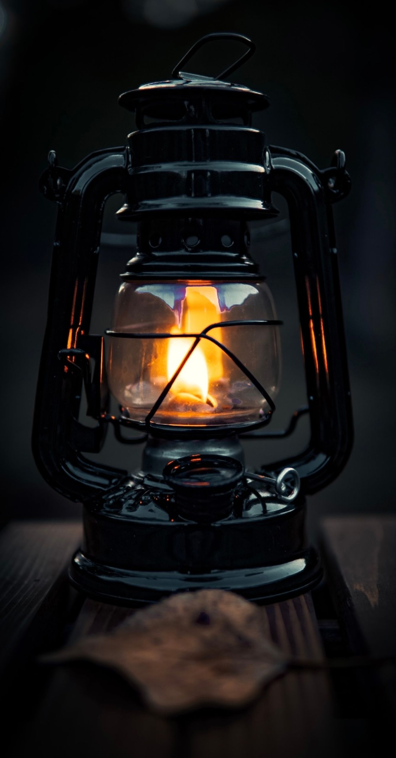 A classic lantern casting a warm glow in the darkness, symbolizing tradition and nostalgia.